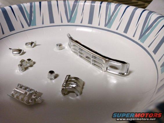 20190321_161408_hdr.jpg You can see that most of the outward facing chrome is still intact. This is because there is a lacquer that is applied to the plastic that helps the chrome plating adhere better. Unfortunately, this lacquer and the chrome result in some very thick coverage and a great loss of detail. Many modelers will dechrome parts only to rechrome them with a thinner plating or chrome paint to regain that detail. Something a bit stronger is needed to remove the chrome and the supporting lacquer, but not harm the plastic underneath.