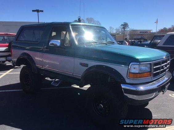 Green and silver SUV with off-road tires, 1992 model year