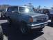 1979 Ford Bronco - This blue Ford Bronco is seen from a 3/4 front angle. The license plate is visible and reads 20210.