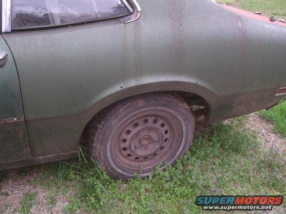 1972 Ford Maverick rear quarter panel, showing the wheel well and a steel wheel