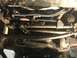 1984 Ford Bronco - Close-up of the steering and suspension system, showing various metal components and hydraulic lines.