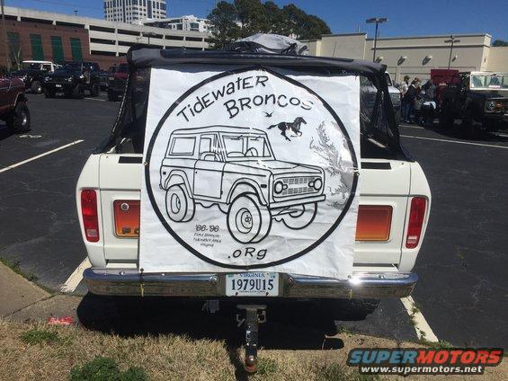 1979 Ford Bronco rear view, white with black soft top, displaying a banner for Tidewater Broncos. License plate reads 1979U15
