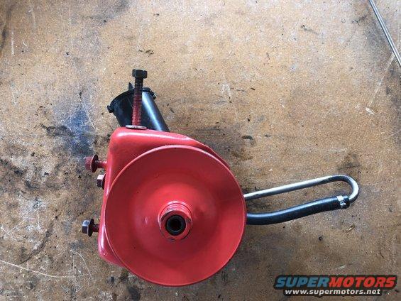 Red power steering pump with pulley and hose