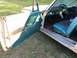 1960 Ford Starliner - Interior view of a 1960 Ford Starliner, teal door panels and seats.