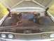 1960 Ford Starliner - The engine compartment of a vintage car, a V8 engine and a prominent blue air filter housing.
