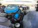 1960 Ford Starliner - Engine bay of a 1960 Ford Starliner, a blue air cleaner and valve covers.
