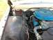 1960 Ford Starliner - Close-up of a car's engine bay, showing the air cleaner and coolant overflow tank.