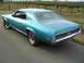 1969 Mercury Cougar - This 1969 Mercury Cougar is a teal coupe with chrome accents and a distinctive grille.