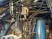 1967 Lincoln Continental - A complex network of fuel lines and electrical components is visible in this engine bay shot.