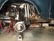 1979 Ford Bronco - The rear suspension system of a vehicle is shown elevated on jack stands for maintenance.