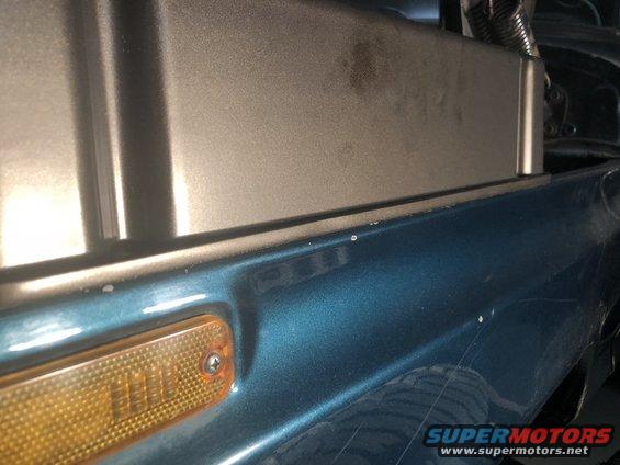 Teal fender and amber turn signal
