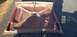 1962 Ford Galaxie - The underside of a car hood, showing its internal structure and signs of age.