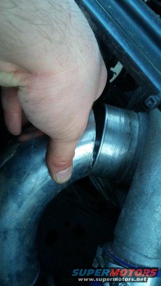 hand holding metal intake hose