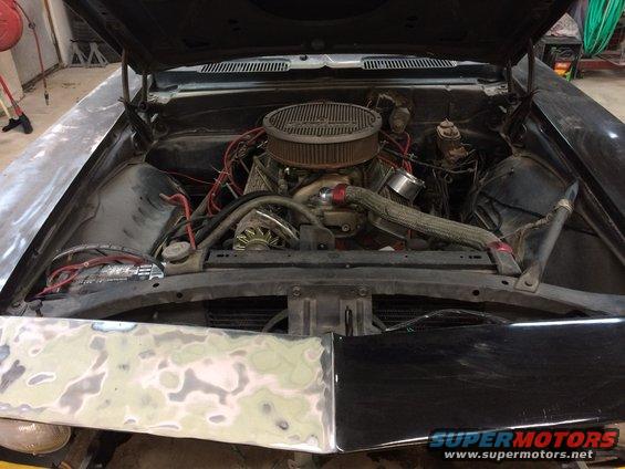 1969 Chevrolet Camaro engine bay with V8 engine, air cleaner, and battery visible
