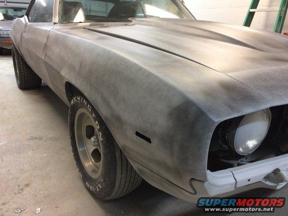 Gray primer 1969 Chevrolet Camaro front fender and hood, driver's side