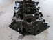 1970 Ford Torino - A bare engine block sits on a concrete surface, with the Supermotors.net logo in the corner.