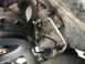 1989 Ford Bronco - Close-up view of the power steering pump and associated plumbing on a vehicle.