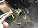 1995 Ford Bronco - Messy vehicle wiring harness visible inside the cabin, near the driver's footwell.
