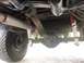 1995 Ford Bronco - Undercarriage view of a truck, focusing on the rear axle and suspension.