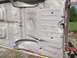 1962 Ford Galaxie - The underside of a 1962 Ford Galaxie frame is visible, with details of the floor pan and suspension mounting points.