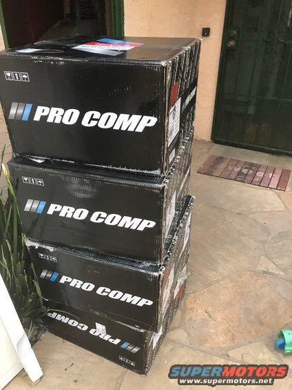 Four stacked Pro Comp boxes on a stone patio