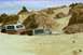 1979 Ford Bronco - Two SUVs are stuck in the sand dunes, with one vehicle almost completely buried.