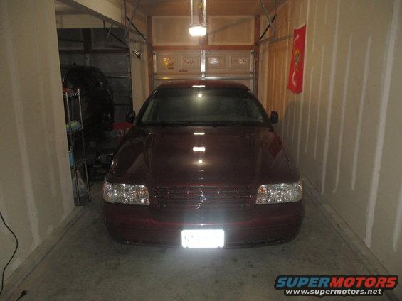 2004 Ford Crown Victoria parked in a garage, front view