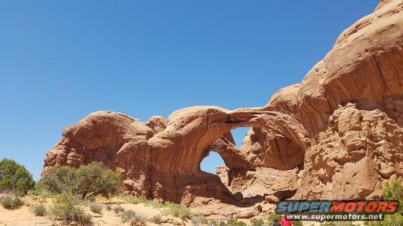 Double Arch rock formation under a clear blue sky
