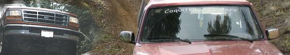 1987 Ford Bronco front grille and headlights, driving on a dirt road