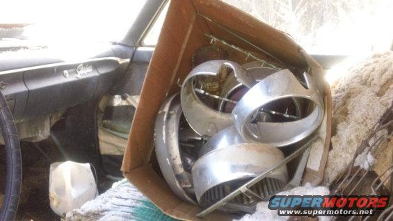 1961 Ford Starliner interior with a box of chrome trim parts