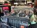 1992 Jeep Wrangler - A 1992 Jeep Wrangler in a garage with its hood open, revealing the engine compartment and aftermarket headlights.