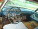 1962 Ford Galaxie - Interior view of a vintage car, showing the dashboard, steering wheel, and worn seating.