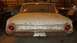1962 Ford Galaxie - Rear view of a 1962 Ford Galaxie, showing its distinctive taillights and chrome trim. The car appears to be in storage.