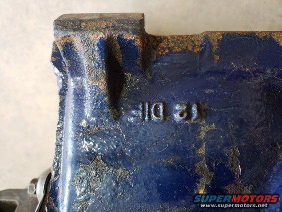 Blue cast iron part with raised markings '12 DIF 21'