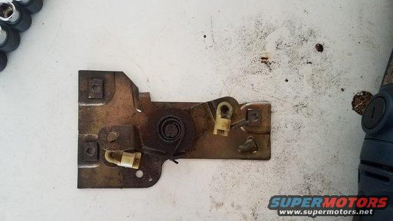 Door latch mechanism with yellow plastic components