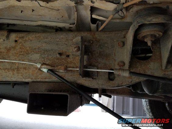 20190529_192713.jpg I found that the E150 e-brake cables connected directly to the Bronco pedal cable.  But it's about 5" too long to lock into the Bronco frame tab, so I have to take up that slack.