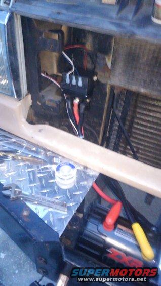 kimg0585.jpg i dont like the big solenoid box on the top of the winch. so like i did on my broncos winch, i disassembled the box and mounted the solenoid on the core support behind the grille. i extended the wiring for remote plug but was able to reuse the main cables to the winch
