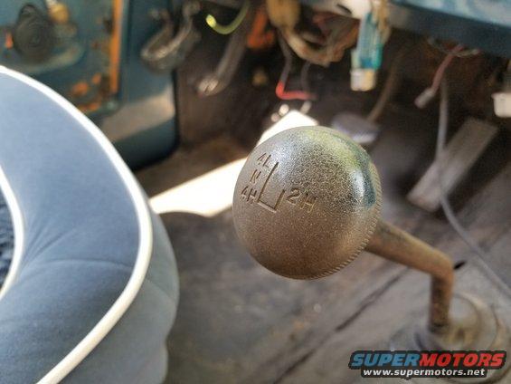 20190515_100856.jpg I think at least one of the door limit strap bars needs to be turned around so the door doesn't swing as far. But the chairs have REALLY-nice original-looking upholstery. The driver's floor & tunnel have been sheeted over (obscuring that body mount bolt), but there are holes drilled through both layers on both sides of the tunnel (among MANY other open firewall & floor holes). The mirror remote control doesn't seem to work.  We haven't attempted to shift the transfer case yet.