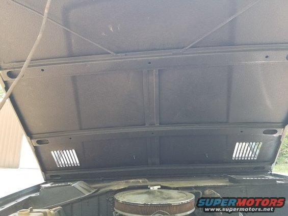 The hood looks OK, but the bedliner goes out to the surface of the paint on the vent louvers.  The prop rod is mangled.