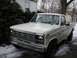 1986 Ford F-150 - This 1986 Ford F-150 pickup truck is shown from a 3/4 front angle on a snowy day.