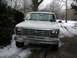 1986 Ford F-150 - Front view of a white 1986 Ford F-150 pickup truck parked outside in the snow.