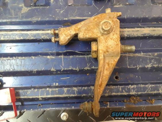 Rusty metal bracket with bolts and threaded rod