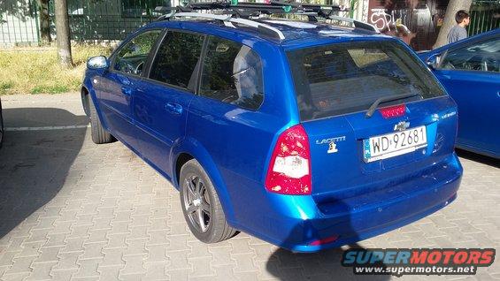 Blue station wagon with roof rack, license plate WD-92681, and 'LACETTI' badging