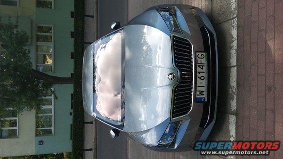 Silver Skoda Octavia parked on a street, front view. License plate WI 614FG