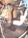 1991 Ford Crown Victoria - Close-up view of the floor pedals and surrounding mechanical components inside a vehicle.