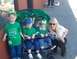 1996 Ford Bronco - A woman poses with three children in a stroller, all dressed in green for an Irish celebration.