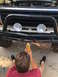1981 Ford Bronco - Modifying the front bumper of a truck, likely a Ford Bronco from the early 1980s.