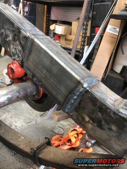 Welded frame section with leaf spring and differential