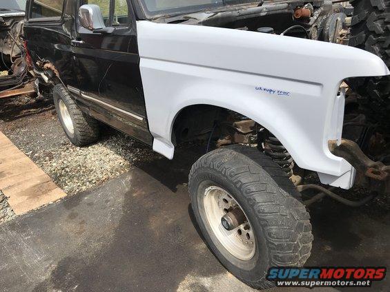 1992 Ford Bronco front fender, white, with blue text reading "4.9L V8 EFI"