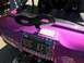1970 Volkswagen Beetle - This custom dune buggy features a "Bug Key" license plate and a playful wind-up key decoration on its vibrant purple body.